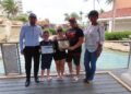 Aruba Tourism Authority Honors Loyal Visitors Mr. Jon & Mrs. Cheri Grinberg and Mr. Anthony Grinberg at Marriott’s Aruba Surf Club