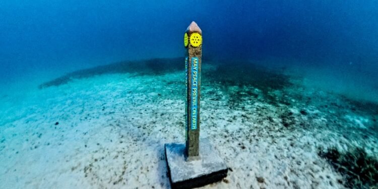Rotary Club Aruba Installs the World’s First Underwater Peace Pole at Tres Trapi Rotary Club Aruba Installs the World’s First Underwater Peace Pole at Tres Trapi