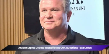 aruba surplus debate intensifies as cua questions tax burden