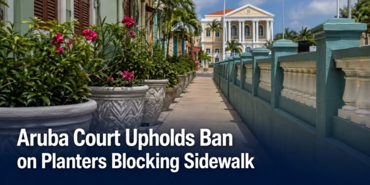 Planters beside a narrow public sidewalk representing an Aruba court ruling