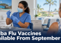 Healthcare worker preparing an influenza vaccine at an Aruba clinic