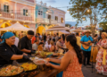 Chefs serving local food at a cultural festival in downtown Oranjestad