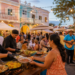 Chefs serving local food at a cultural festival in downtown Oranjestad