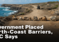 Rock barriers blocking a dirt route along Aruba’s rugged north coast