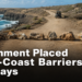 Rock barriers blocking a dirt route along Aruba’s rugged north coast