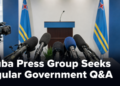 Microphones in an Aruba press room representing a request for regular government questions