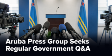 Microphones in an Aruba press room representing a request for regular government questions