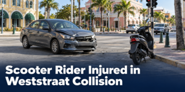 Car and scooter at an Aruba intersection after a collision
