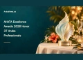 Editorial illustration of a generic seashell-inspired award on a warmly lit hospitality celebration table; not a photograph of the AHATA ceremony or its actual trophy.