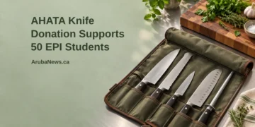 Conceptual editorial illustration of a professional culinary student knife roll open safely on a spotless training kitchen counter beside fresh herbs and a wooden chopping board, with the article headline and ArubaNews.ca branding.