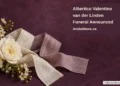 Albertico Valentino van der Linden Funeral Announced Conceptual memorial illustration of white flowers and blank folded linen ribbons on a plum tabletop, with the article headline and ArubaNews.ca branding; not a photograph of the person or funeral.