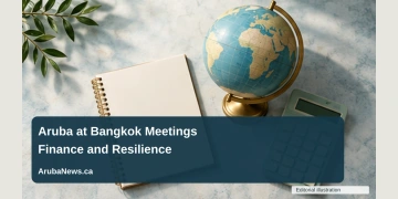 Aruba Central Bank Reviews Bangkok Meetings on Finance and Resilience Conceptual editorial illustration of an overhead arrangement of a blank conference notebook, a plain globe and an unmarked calculator on a light stone table, soft teal daylight, no logos or writing; not a documentary photograph of the people, venue or event.