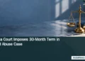 Aruba Court Imposes 30-Month Term in Child Abuse Case Editorial illustration of brass justice scales and a closed file on a blue desk; headline and ArubaNews.ca branding. No real courtroom or people depicted.