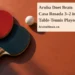 Aruba Doet Beats Casa Rosada 3–2 in Table-Tennis Playoff Conceptual editorial illustration of two table-tennis paddles and a white ball on a terracotta surface, with the article headline and ArubaNews.ca branding.