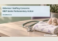 Conceptual editorial illustration of a prenatal-care desk with a stethoscope and folded baby blanket; not a photograph of Aruba’s midwives or a specific clinic.