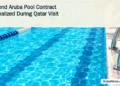 Second Aruba Pool Contract Formalized During Qatar Visit Conceptual editorial illustration of turquoise swimming lanes and a pool ladder, with the article headline and ArubaNews.ca branding; not a design of the planned facility.