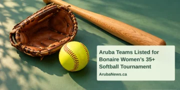 Conceptual editorial illustration of a yellow softball, plain wooden bat and empty glove on a green tabletop, with the article headline and ArubaNews.ca branding.