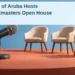 Conceptual editorial illustration of a tabletop microphone facing three empty chair models, with the article headline and ArubaNews.ca branding; not the actual university room.