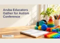 Editorial illustration of tactile learning materials on an empty teacher's desk; not the actual autism conference.