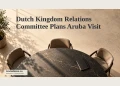Dutch Kingdom Relations Committee Plans Aruba Visit Editorial illustration of an empty conference table, chairs and closed notebook in warm window light.