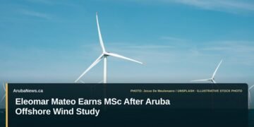 Eleomar Mateo Earns MSc After Aruba Offshore Wind Study Illustrative stock photo for “Eleomar Mateo Earns MSc After Aruba Offshore Wind Study”: Offshore wind turbines in the North Sea. Photo by Jesse De Meulenaere via Unsplash; not a photograph of the specific event. Headline and ArubaNews.ca branding appear in a lower-third news tile.