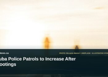 Illustrative stock photo for “Aruba Police Patrols to Increase After Shootings”: Police car traveling on a road. Photo by Riccardo Manieri via Unsplash; not a photograph of the specific event. Headline and ArubaNews.ca branding appear in a lower-third news tile.