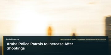 Aruba Police Patrols to Increase After Shootings Illustrative stock photo for “Aruba Police Patrols to Increase After Shootings”: Police car traveling on a road. Photo by Riccardo Manieri via Unsplash; not a photograph of the specific event. Headline and ArubaNews.ca branding appear in a lower-third news tile.