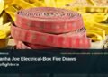 Illustrative stock photo for “Piranha Joe Electrical-Box Fire Draws Firefighters”: Fire hoses arranged for firefighting use. Photo by Dottie Di Liddo via Unsplash; not a photograph of the specific event. Headline and ArubaNews.ca branding appear in a lower-third news tile.