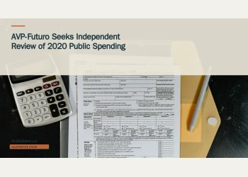 Illustrative stock photograph for “AVP-Futuro Seeks Independent Review of 2020 Public Spending”: Calculator and tax forms on a dark surface; illustrative stock, not Aruba government records. Photograph by Kelly Sikkema via Unsplash. This is not a photograph of the specific Aruba news event.