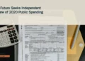 Illustrative stock photograph for “AVP-Futuro Seeks Independent Review of 2020 Public Spending”: Calculator and tax forms on a dark surface; illustrative stock, not Aruba government records. Photograph by Kelly Sikkema via Unsplash. This is not a photograph of the specific Aruba news event.