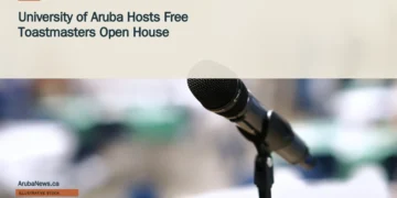 Illustrative stock photograph for “University of Aruba Hosts Free Toastmasters Open House”: Microphone in an empty room; illustrative, not the Toastmasters event. Photograph by Clint Patterson via Unsplash. This is not a photograph of the specific Aruba news event.