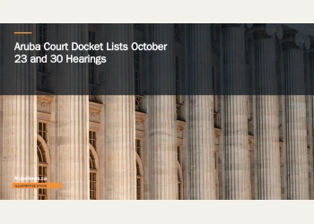 Illustrative stock photograph for “Aruba Court Docket Lists October 23 and 30 Hearings”: a large building with columns and a clock on the front of it Photograph by Colin Lloyd via Unsplash. This is not a photograph of the specific Aruba news event.