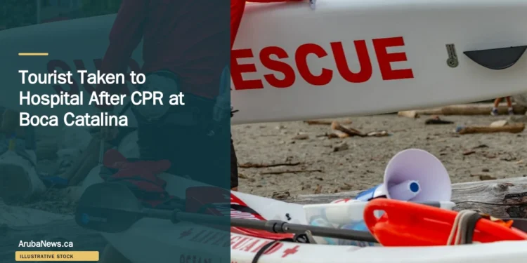Illustrative stock photograph for “Tourist Taken to Hospital After CPR at Boca Catalina”: 2026-07-10 Vancouver beach lifeguard red jacket carrying surf rescue surfboard. Photograph by Anthony Maw via Unsplash. This is not a photograph of the specific Aruba news event.