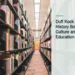 Illustrative stock photograph for “Dufi Kock Presents History Books to Culture and Education”: a long row of books in a library Photograph by Zetong Li via Unsplash. This is not a photograph of the specific Aruba news event.