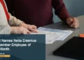 Illustrative stock photograph for “HOH Names Nella Erasmus September Employee of the Month”: Two professionals reviewing paperwork at a conference table during a business meeting in San Francisco. Photograph by Olena Kholina via Unsplash. This is not a photograph of the specific Aruba news event.