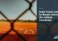 Illustrative stock photograph for “Aruba Teams Listed for Bonaire Women’s 35+ Softball Tournament”: Baseball field seen through a chain-link fence Photograph by Emmanuel Munoz via Unsplash. This is not a photograph of the specific Aruba news event.
