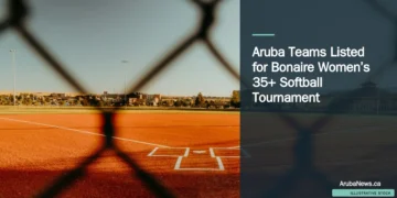 Illustrative stock photograph for “Aruba Teams Listed for Bonaire Women’s 35+ Softball Tournament”: Baseball field seen through a chain-link fence Photograph by Emmanuel Munoz via Unsplash. This is not a photograph of the specific Aruba news event.