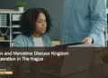 Illustrative stock photograph for “Eman and Mercelina Discuss Kingdom Cooperation in The Hague”: Colleagues reviewing papers; illustrative stock, not the reported meeting. Photograph by Vitaly Gariev via Unsplash. This is not a photograph of the specific Aruba news event.