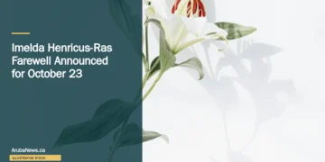 Illustrative stock photograph for “Imelda Henricus-Ras Farewell Announced for October 23”: Lily on white background with shadow Photograph by Evie S. via Unsplash. This is not a photograph of the specific Aruba news event.