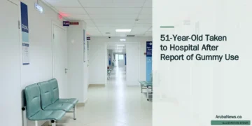 Illustrative stock photograph for “51-Year-Old Taken to Hospital After Report of Gummy Use”: Empty hospital corridor with benches and doors Photograph by Tasha Kostyuk via Unsplash. This is not a photograph of the specific Aruba news event.
