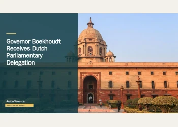 Illustrative stock photograph for “Governor Boekhoudt Receives Dutch Parliamentary Delegation”: beige concrete building under blue sky during daytime Photograph by Maahid Photos via Unsplash. This is not a photograph of the specific Aruba news event.