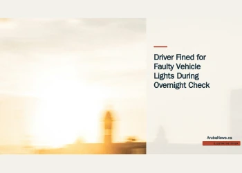 Illustrative stock photograph for “Driver Fined for Faulty Vehicle Lights During Overnight Check”: Police vehicle on road; illustrative stock, not the actual vehicle check. Photograph by Riccardo Manieri via Unsplash. This is not a photograph of the specific Aruba news event.