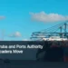 Illustrative stock photograph for “FreeZone Aruba and Ports Authority Explore Barcadera Move”: Container carrier waiting to take off. Hai Phong International Container Terminal (HICT), Vietnam (Jully 2022) Photograph by Nathan Cima via Unsplash. This is not a photograph of the specific Aruba news event.