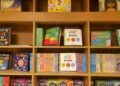 Knipscheer Tribute at Aruba Library Set for October 21 Illustrative stock photo for “Knipscheer Tribute at Aruba Library Set for October 21”: Children’s books arranged on library shelves. Photo by Zoshua Colah via Unsplash; not a photograph of the specific event.