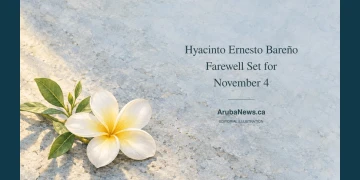 Hyacinto Ernesto Bareño Farewell Set for November 4 Watercolour editorial illustration of a white frangipani blossom and green leaves on pale blue-grey stone, with the Hyacinto Ernesto Bareño farewell headline and ArubaNews.ca branding.