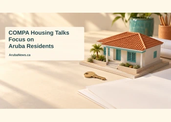 Conceptual editorial illustration of a miniature Caribbean home, brass key and blank planning sheets, with the COMPA housing headline and ArubaNews.ca branding.