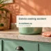 Woman Hospitalized After Reported Cooking Accident in Dakota Conceptual editorial illustration; Original neutral editorial illustration, unoccupied Caribbean kitchen with a closed cooking pot and an oven mitt on a counter, side-on perspective, soft afternoon light, pale terracotta and mint palette, negative space at top. Not a documentary image of the reported event.