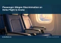 Passenger Alleges Discrimination on Delta Flight to Aruba Conceptual editorial illustration: Empty generic aircraft cabin seats beside a softly lit window, navy and cream palette, eye-level close composition, no passengers, airline logos, text or actual aircraft identifiers. Not a photograph of the actual event, people or location.
