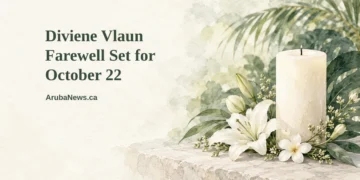 Conceptual editorial illustration of a simple white flower arrangement and a single unlit candle on a pale stone surface with soft out-of-focus caribbean foliage, with the article headline and ArubaNews.ca branding.