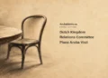 Conceptual charcoal editorial illustration of an unoccupied generic chair beside a curved table edge on parchment, with the headline Dutch Kingdom Relations Committee Plans Aruba Visit and ArubaNews.ca branding.